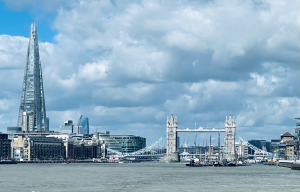 Photos looking west along the Thames river showing sailboats, Tower Bridge and The Shard