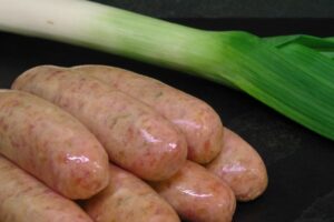 Tasty sausages, and for no narratively justified reason, a leek.
